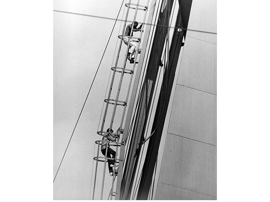 Activist Percy Green (top) climbs the under-construction St. Louis Arch in 1964 to protest the lack of Black workers hired for the construction crew.